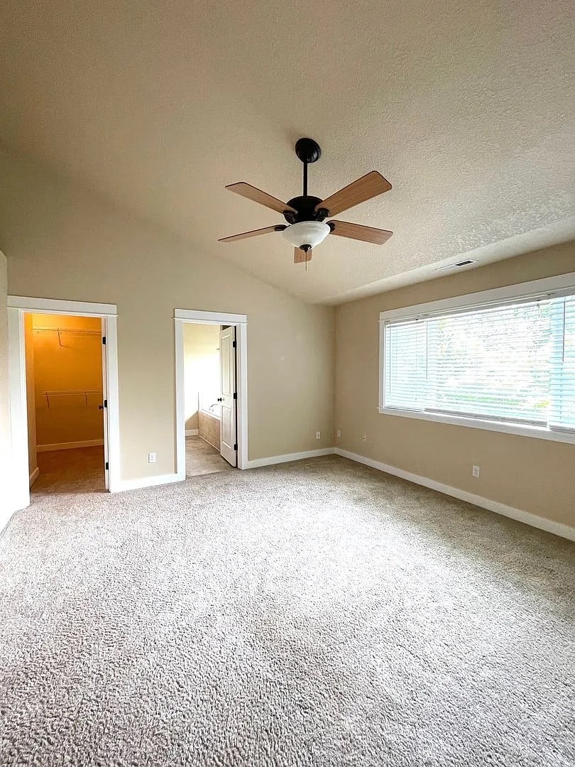 master bedroom with walk-in closet - 831 NW Douglas Pl