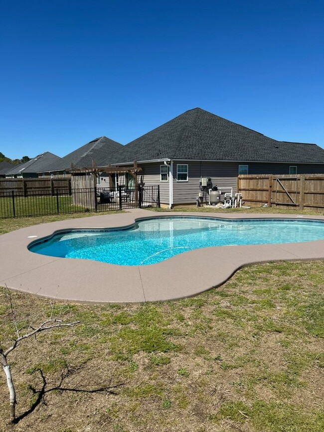 Building Photo - POOL - Elegant 4-Bedroom Home with Fenced ...