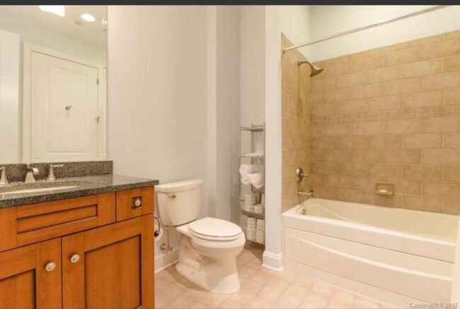 Bathroom with Massager Tub; has additional storage not shown in pics - 230 S Tryon St
