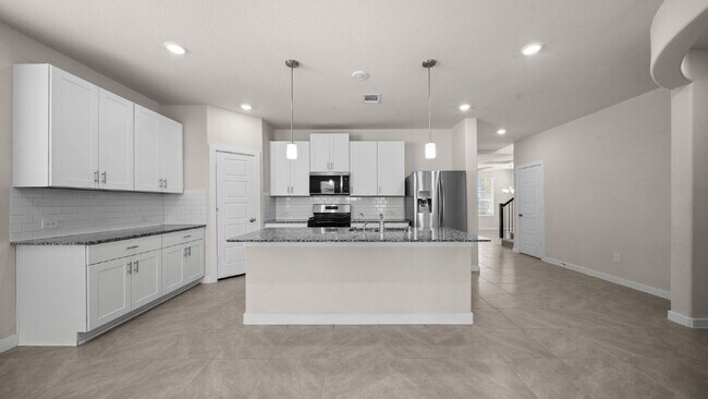 Building Photo - Spacious and well-maintained 4-bedroom, 3.5-bath home in desirable Pine Lake Cove offering flexib...