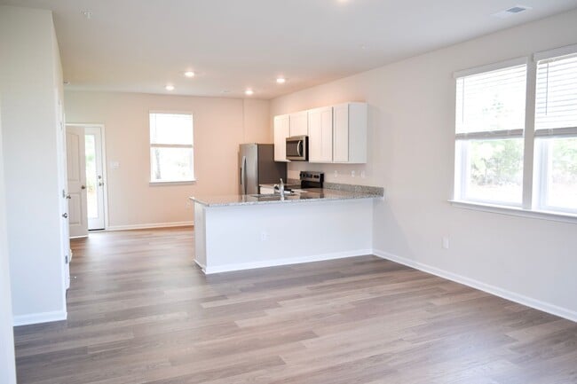 Building Photo - Stunning Brand New End Townhome