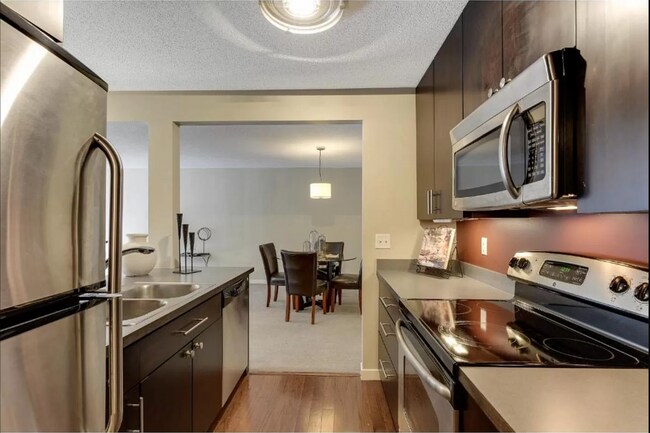 Building Photo - 1Bd/1Ba with Heated Parking, Stainless Steel Appliances, and Pool Access