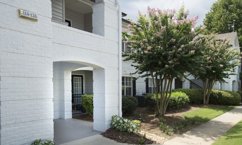 Building Exterior with Lush Landscaping - The Kendrick