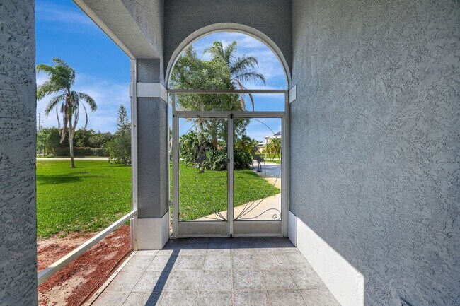 Building Photo - A BOATER'S PARADISE WITH THIS STUNNING 3 BEDROOM, 2 BATH WATERFRONT POOL HOME W/DOCK & BOAT LIFT ...