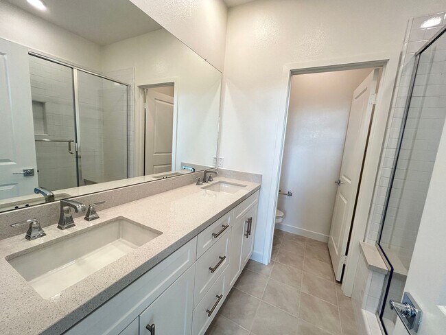 Building Photo - Gorgeous, 3 level townhome, featuring 2 car garage central Air, and in Unit laundry.