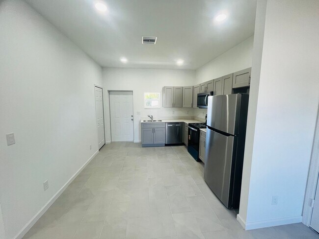 Building Photo - Brand-New Modern 2BR/2BA Home with Garage on Oversized Lot – Prime SW Lehigh Acres Location