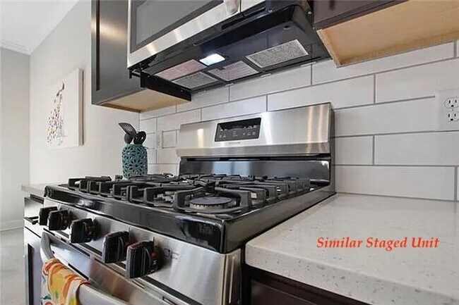 Building Photo - Stunning and Bright 3BR 2.5BA Townhome w/ 2-Car Garage • Quartzite Kitchen • Deck in Parkville