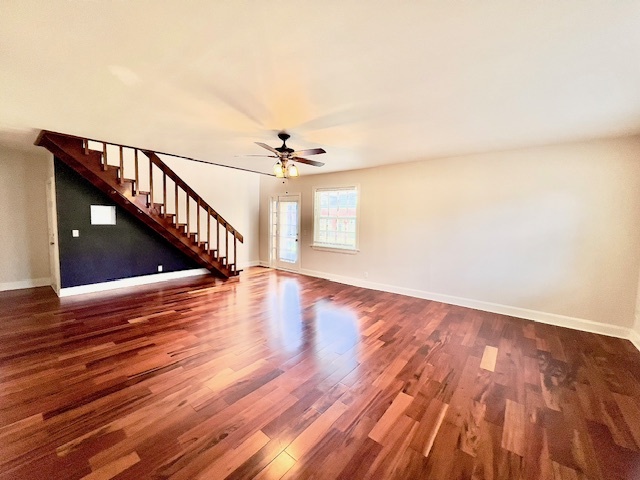 Living room with stairs to the master bedroom and a door to the balcony - 849 Lasalle St