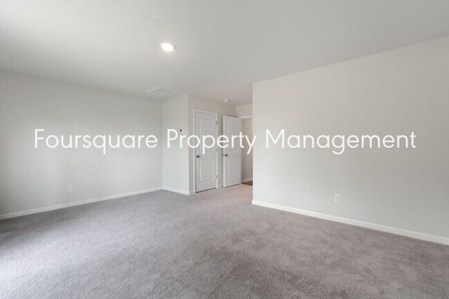 Building Photo - Stylish 3-Level Townhome with Bonus Suite, Deck & Garage – Near I-540 and Shopping