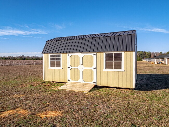 Building Photo - Available now! Has solar panels!