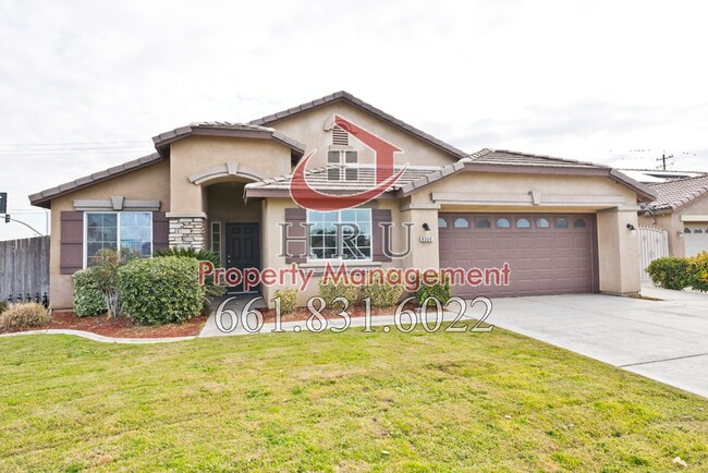 Building Photo - SW-Bakersfield  features 4 bed 2 bath with...