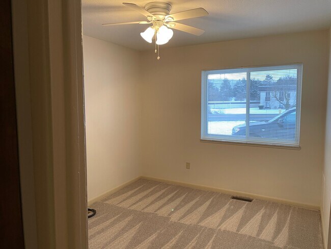 Bedroom 2 with ceiling fan and closet - 8410 N Akins Rd