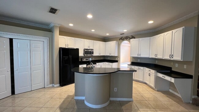 Building Photo - Spacious 4/3.5 Pool Home with Water View & 3-Car Garage in Lee Vista Area (close to Lake Nona)