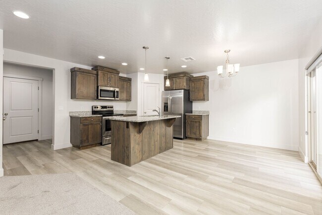 Building Photo - 3 bed | 2.5 bath | 2-car Townhome with Was...