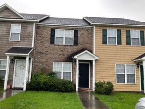 Building Photo - Charming two bedroom one and a half bath town home that is centrally located. Just a short drive ...