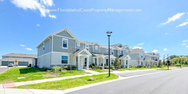 Building Photo - EXCEPTIONAL AND SPACIOUS FURNISHED TOWNHOME WITHIN WATERSIDE- NAUTIQUE!