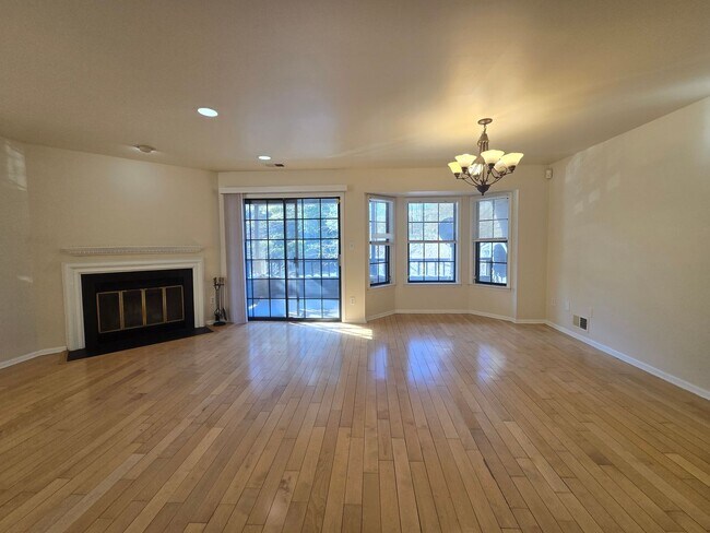 Building Photo - Commuter's delight! Spacious 2nd fl: 2-bed, 2-bath condo with fireplace, washer & dryer & off-str...