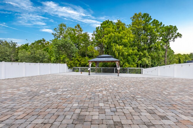 Building Photo - Spacious 6-Bedroom Home Near Lake Nona | 3-Car Garage + Tesla Charger