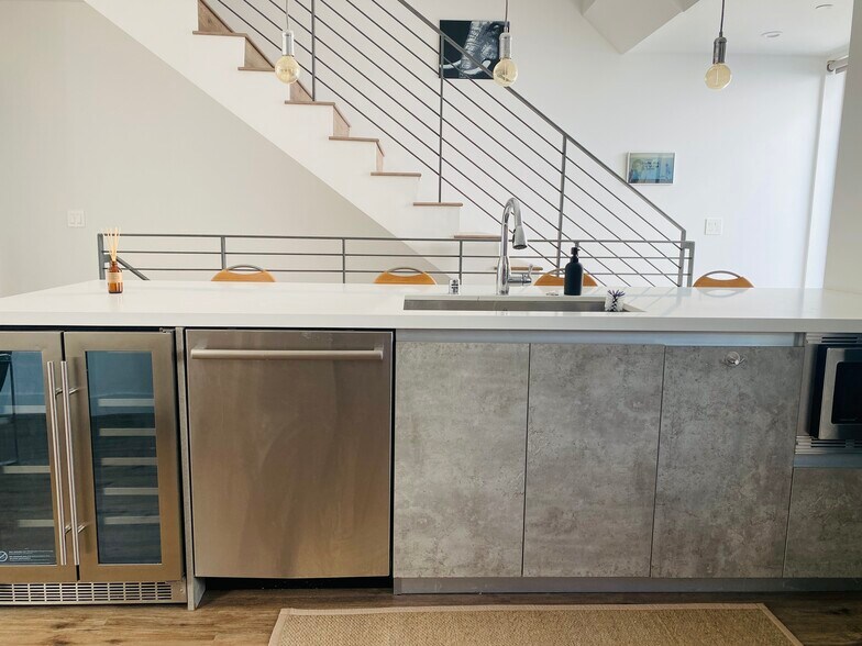 2nd Floor Kitchen Island with wine cooler, dishwasher and microwave. - 7197 Formosa Fusion Ct