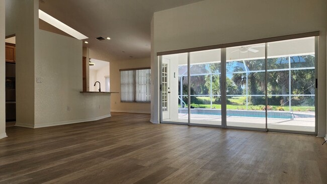 Building Photo - Fresh Paint, New Floors, and a Heated Pool...