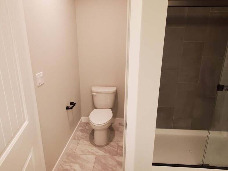 Master bedroom toilet with door for privacy - 161 E Wayno Way