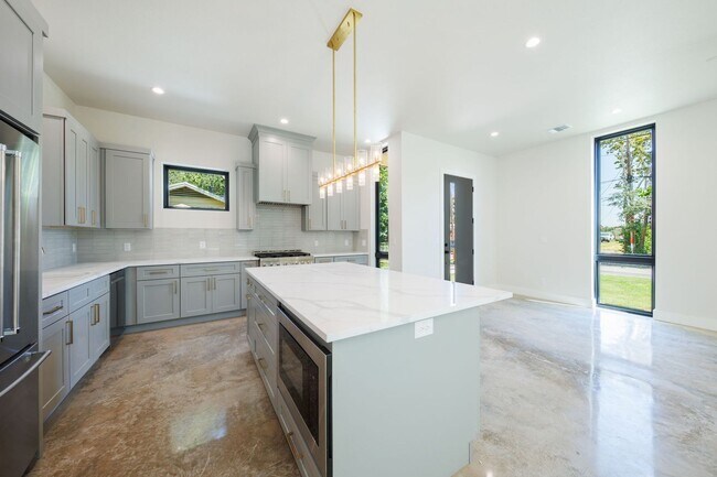 Building Photo - Luxury Redefined: Experience Vibrant Living in this 3-Bedroom Haven in East Austin