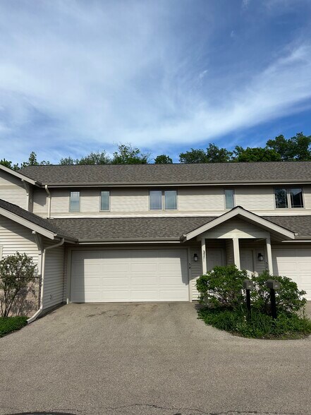 Rear entrance of property with garage door - 54 Wood Brook Way