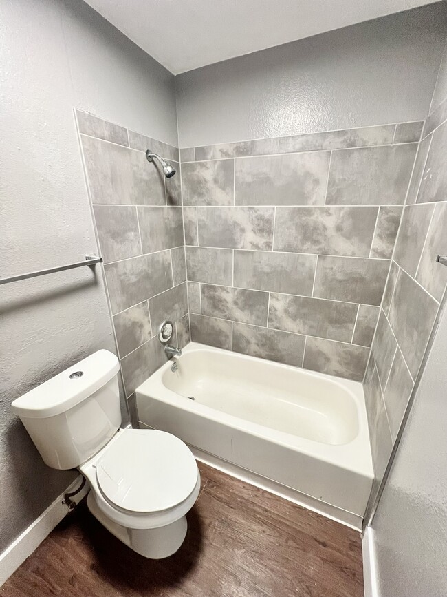 Experience elegance in this modern bathroom with stylish tile work. - Williams Street