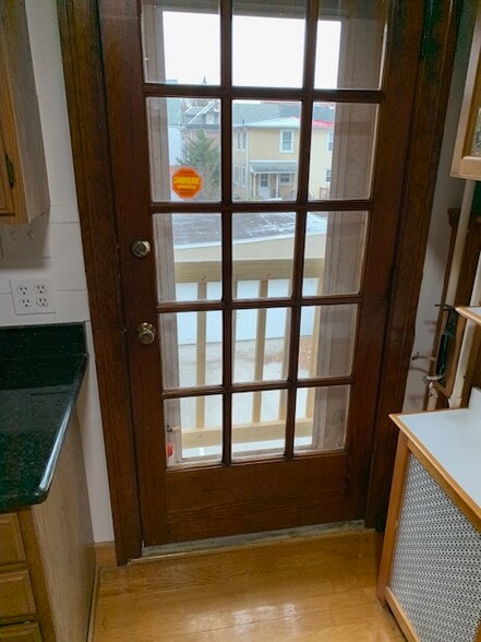 Door in kitchen that can be opened for fresh air. - 832 Cricket Ave