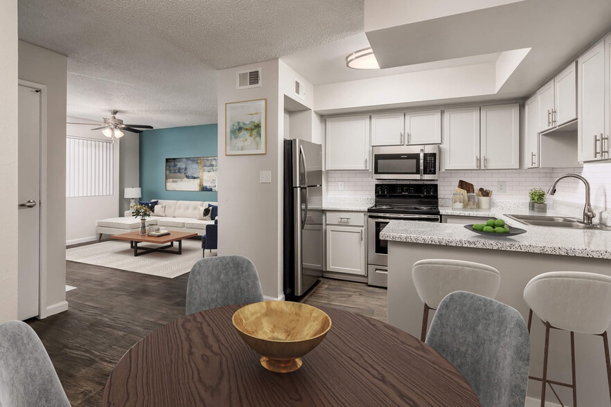 Open-Concept Kitchen with Stainless Steel Appliances - Diamond Interior - Coral Point Apartments