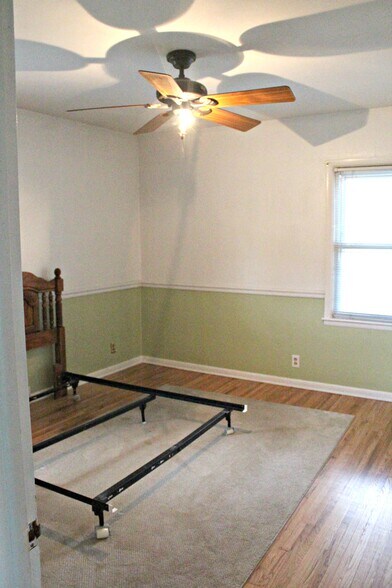 Both bedrooms feature hardwood flooring. - 1624 elmhurst ave