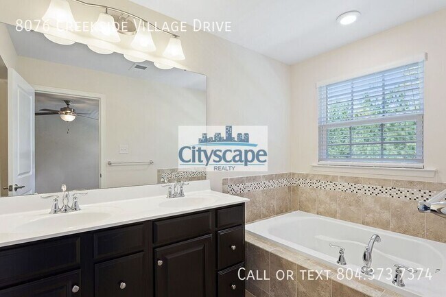 Building Photo - 8076 Creekside Village Dr