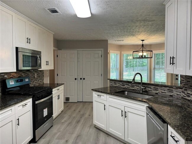 Building Photo - 7454 Woody Springs Dr