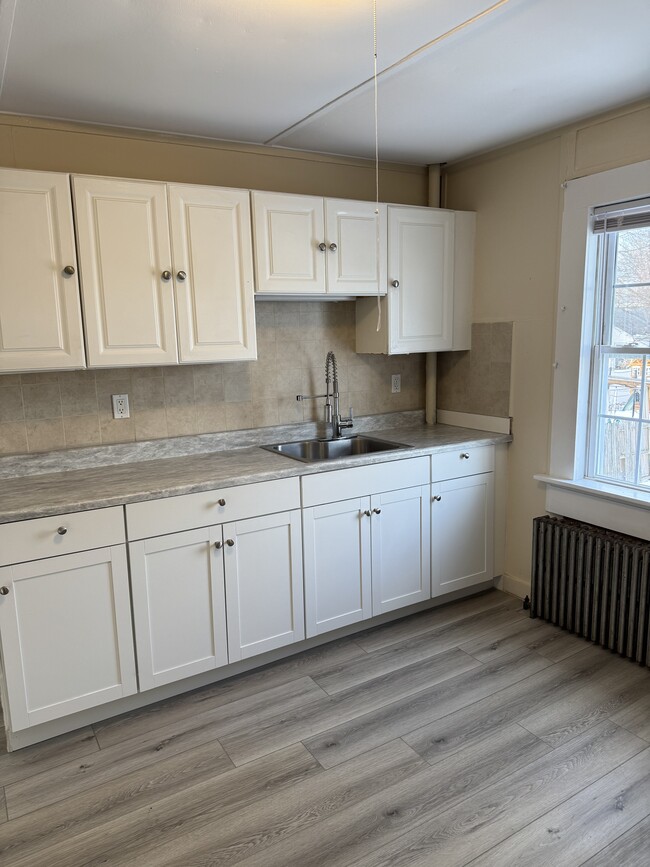 New kitchen counters and cabinets - 88 E Marie St