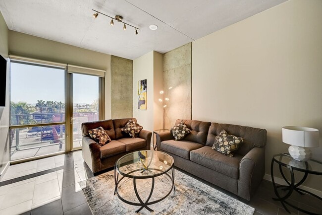 Building Photo - Fully Furnished 4th-Floor Condo with Stunning Downtown Views!