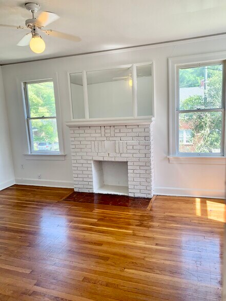 Living room with decorative fireplace - 768 Acosta St