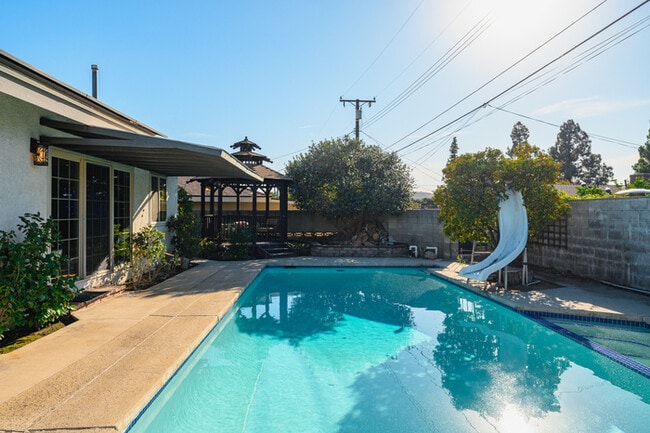 Building Photo - Luxury Estate with Sparkling Pool & Elegant Amenities
