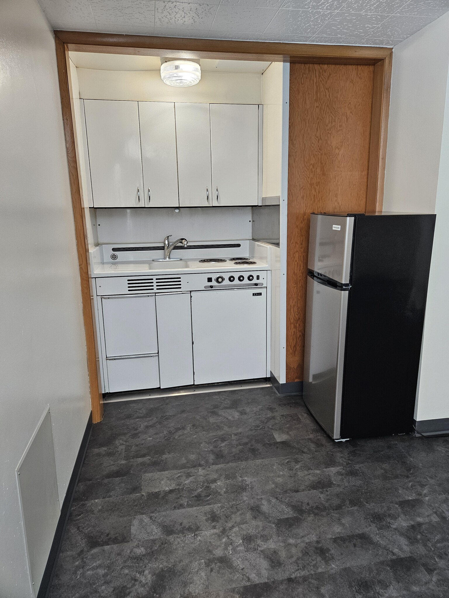 Kitchen area with new refrigerator - 1106 W Wisconsin Ave