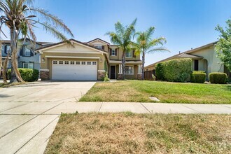 Building Photo - Spacious 4-Bedroom Home with Den – North Y...