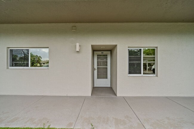 Building Photo - first-floor unit featuring a 2 bedroom, 2 bath fully furnished