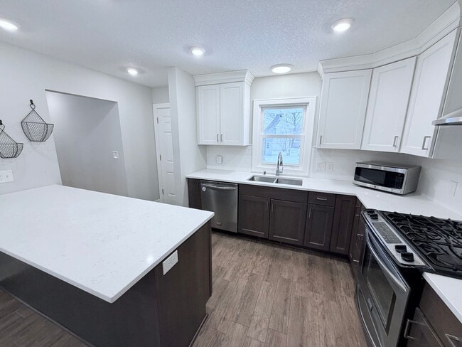 Building Photo - Spacious 4-Bedroom Home with Pond Views & EV-Ready Garage – Bloomington!!