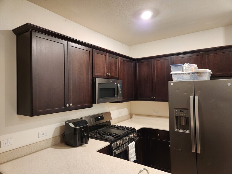 Kitchen with plenty of storage space and gas range. - 13306 Mussel Run