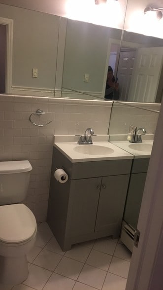 stall shower w subway tiles - 300 7th Ave