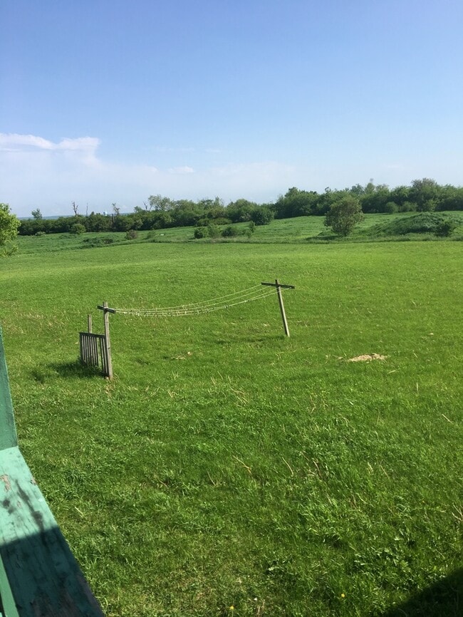 Building Photo - Beautiful secluded 4 bedroom 2.5 bath home with 2 stall detached garage and descent sized yard