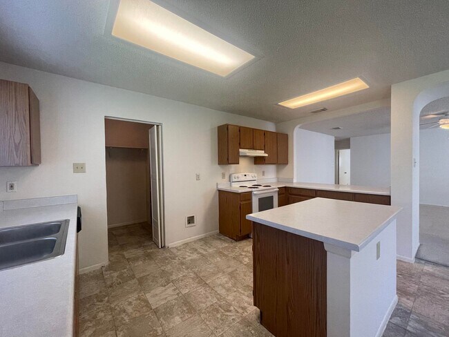 Building Photo - NICE 3 BEDROOM FEATURING AN ISLAND KITCHEN...
