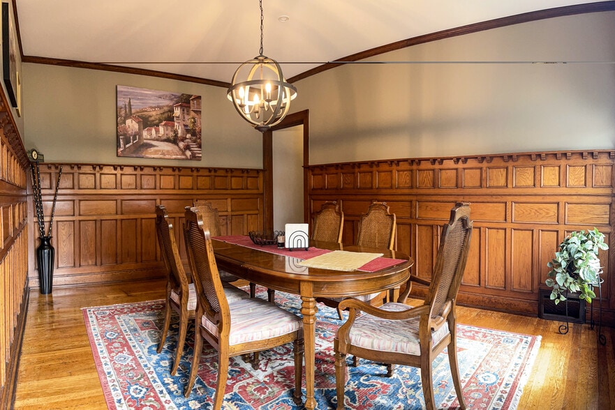 [Dining room] Features all-original wood paneling, and stained-glass window. - 103 Lancaster Ave