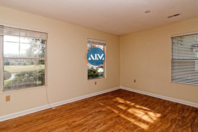 Building Photo - Charming First-Floor Condo with Pond Views at The Estate at Westbury