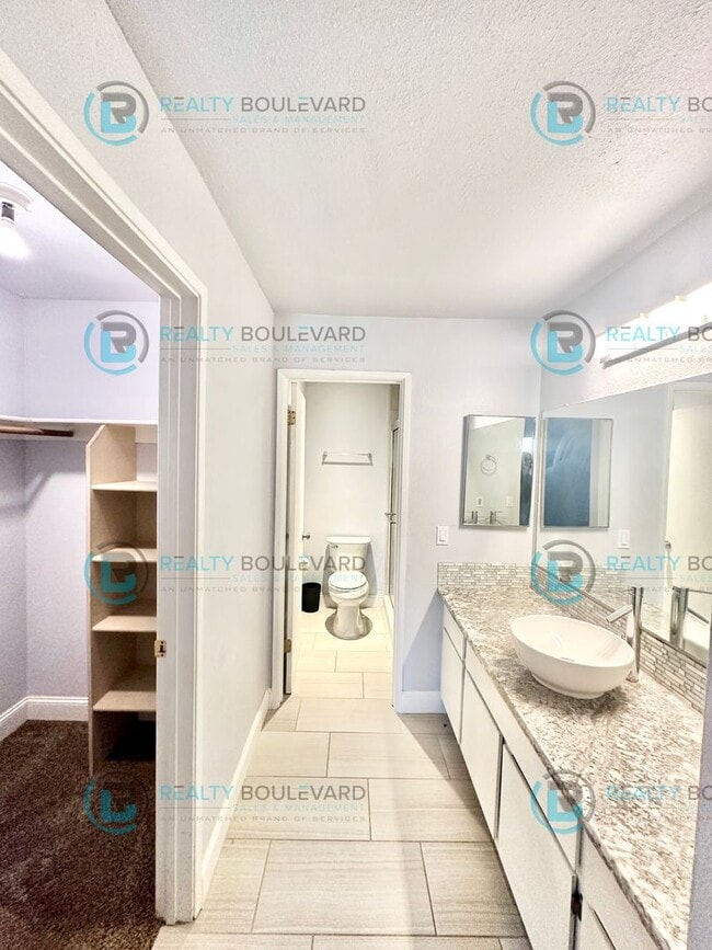 Building Photo - Indulge in comfortable living at Wood Chase Condos!