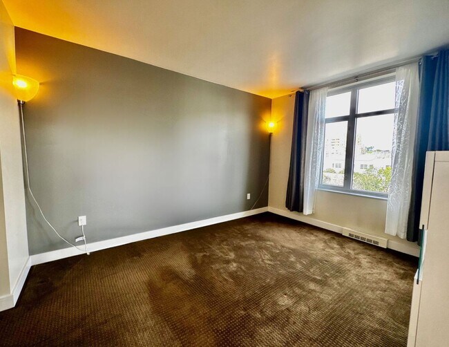 Building Photo - Corner Light. City Energy. Zero Compromise.