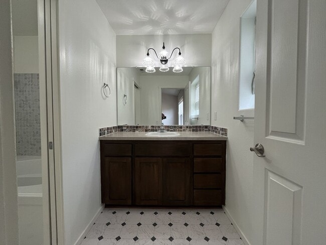 Building Photo - Beautiful 2 Bedroom Townhome with Walk-In Closets Private Deck & Attached Garage